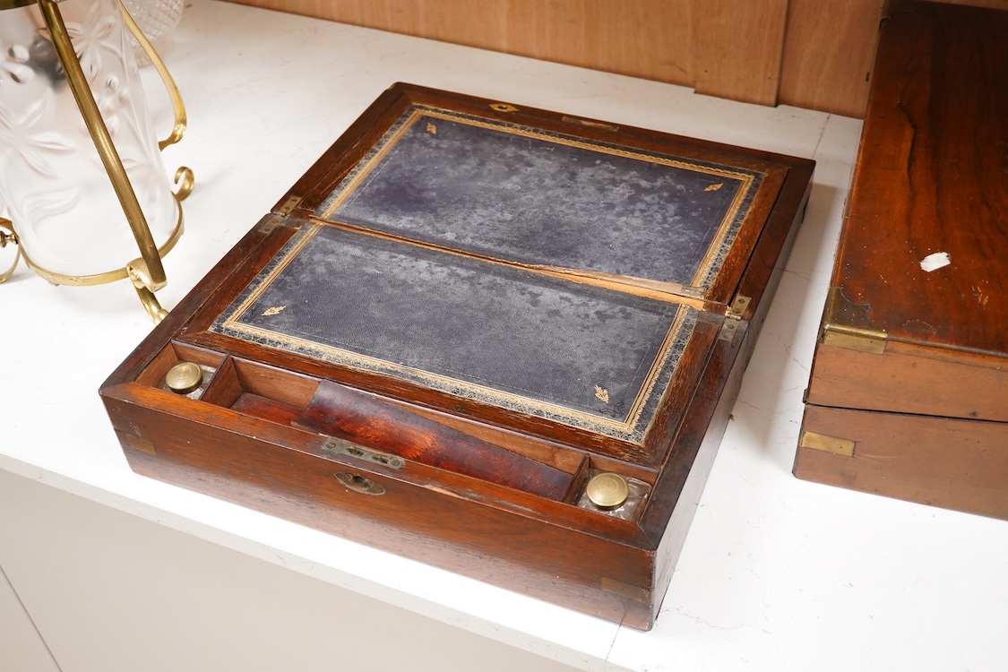 A Victorian walnut rising slope together with a rosewood writing slope